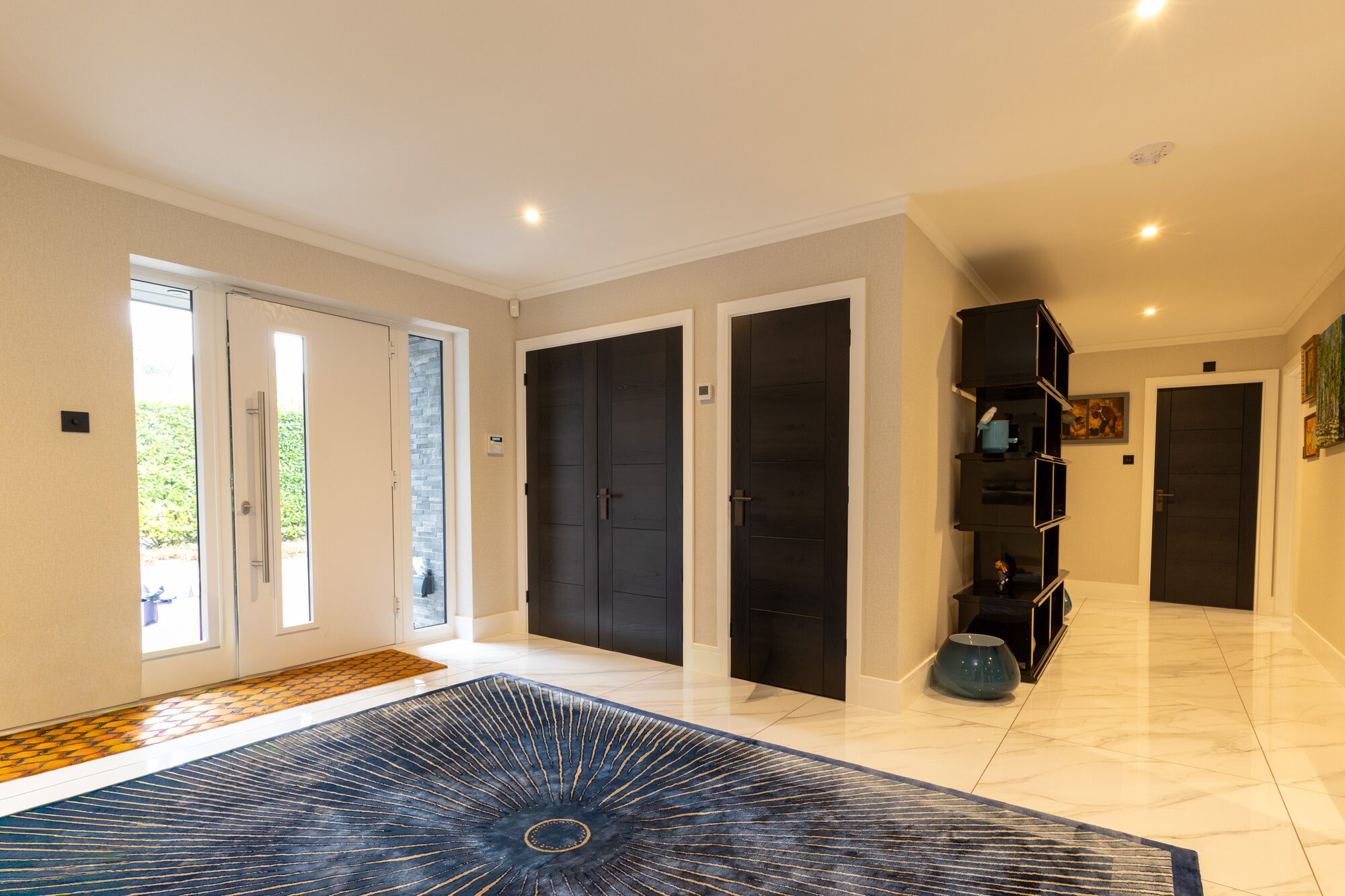 Dark timber internal doors with painted frames and lever handles